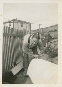 Image of Pep Wheeler, anthropologist, preparing canoe and supplies for going into interior